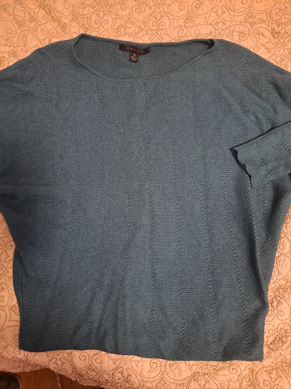 Lightweight teal knit sweater is a size XS from the brand Cyrus. This top has a
